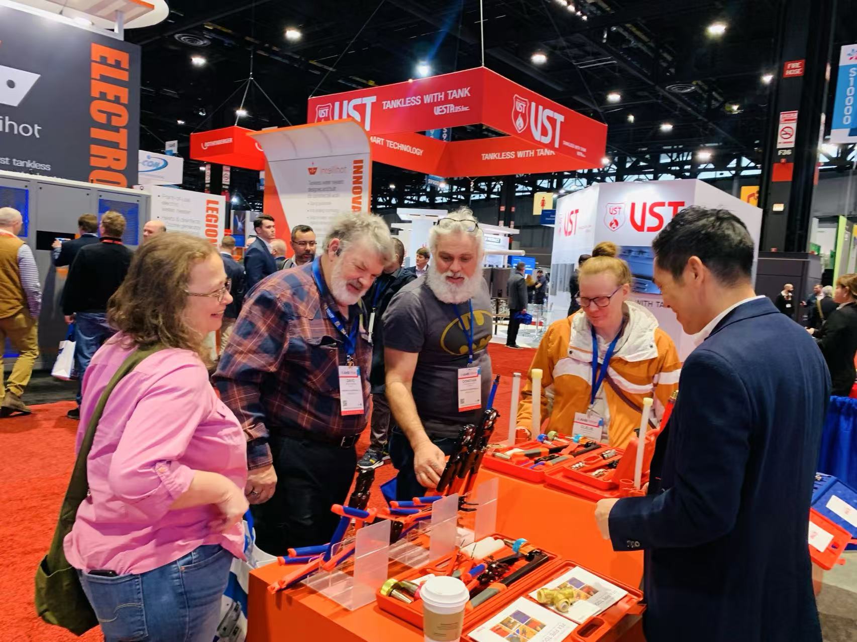 IWISS team demonstrating connection tools to visitors at AHR Expo