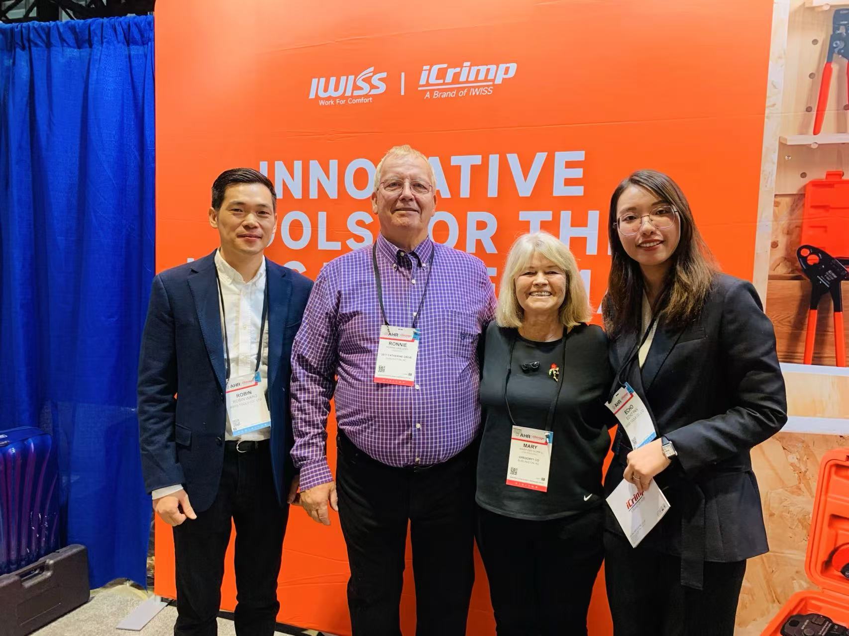 IWISS and iCrimp team members with visitors at the AHR Expo booth